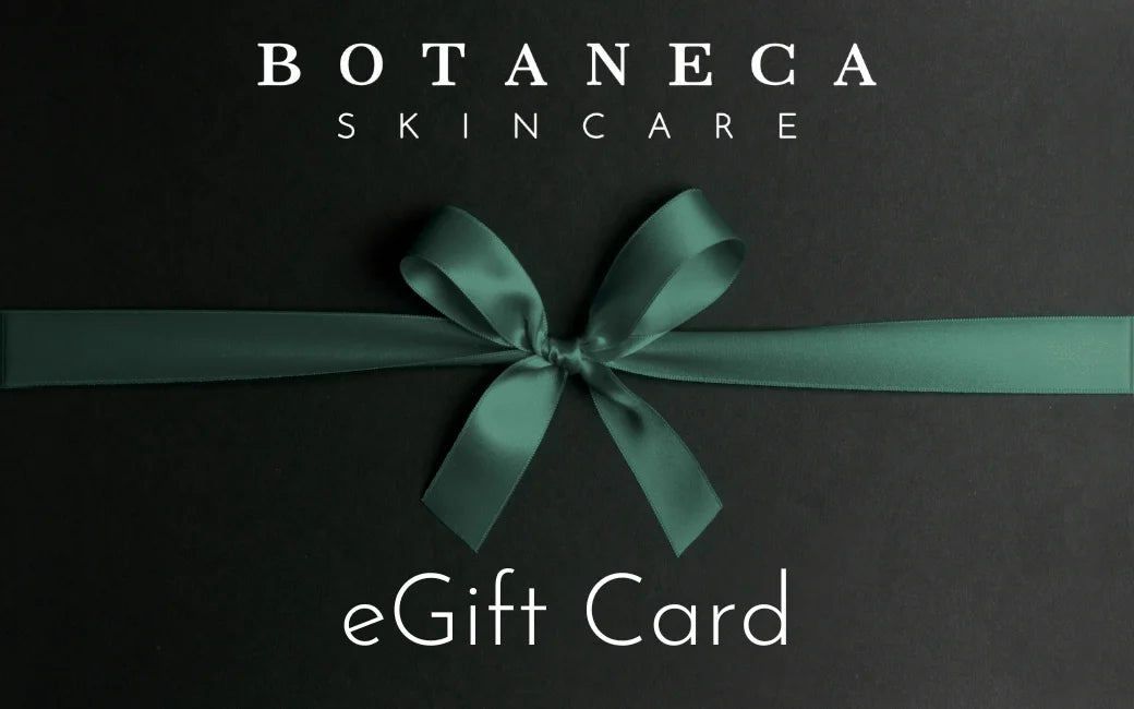 Botaneca Skincare eGift Card with a green ribbon on a black background